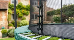 Close-up of a secure, fine-mesh safety enclosure on a 10ft trampoline.