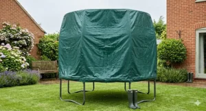 An 8ft outdoor trampoline covered with a waterproof winter rain cover in a wet British garden.