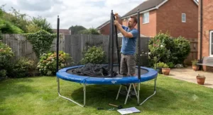 A parent assembling a 10ft garden trampoline safety enclosure