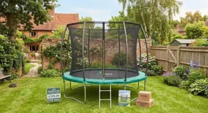 A high-quality 12ft trampoline with enclosure standing on a flat lawn, ready for garden fun.
