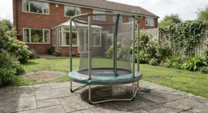 A weather-resistant toddler trampoline positioned on a patio in a British back garden