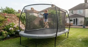 A child enjoying a controlled, responsive bounce on an oval trampoline