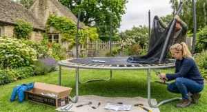 A 12ft trampoline during assembly in a typical UK residential garden