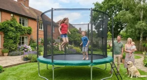 Children jumping safely on a heavy duty 12ft trampoline outdoors
