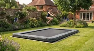A securely installed flush-to-lawn in-ground rectangular trampoline suitable for garden gymnastics