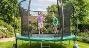 Happy children playing safely on a large heavy duty 14ft trampoline outdoors.