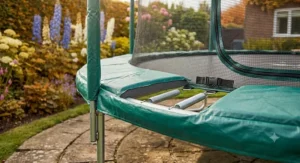Detailed view of the thick foam padding on a large garden trampoline for child safety.