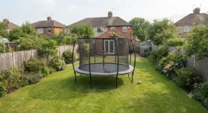 A large round trampoline installed in a square family lawn