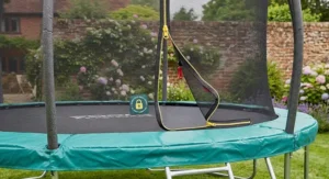 The secure zipped entrance door of a 12ft trampoline with enclosure for child safety.