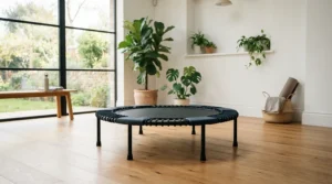 A gentle rebounder for lymphatic drainage set up in a dedicated home gym space.