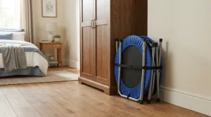 Storing a compact folding mini trampoline for weight loss neatly in a small bedroom wardrobe space