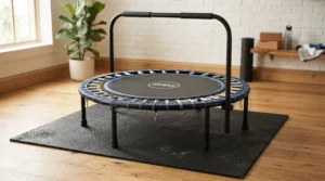 A safe setup featuring a rebounder for beginner workouts placed securely on a protective floor mat.