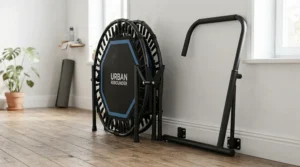 A detached balance bar for fitness trampoline stored neatly next to a rebounder in a flat